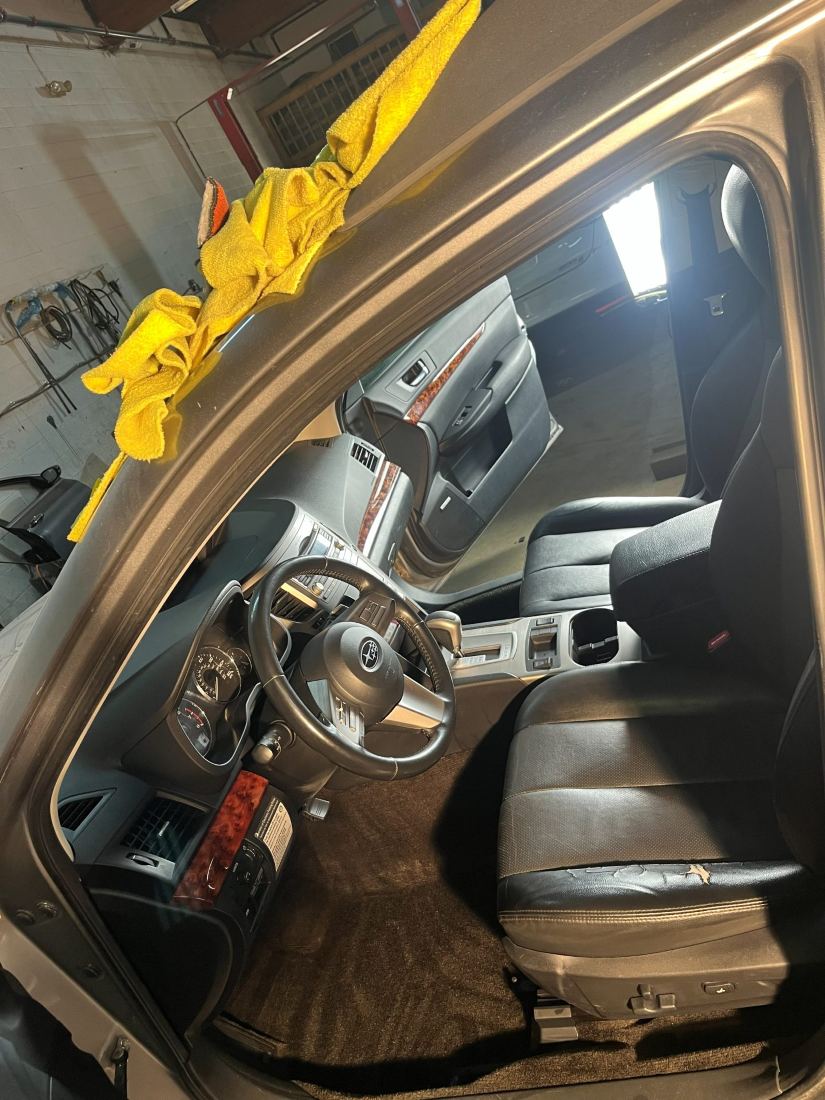 Dr. Detail technician hand-detailing a vehicle